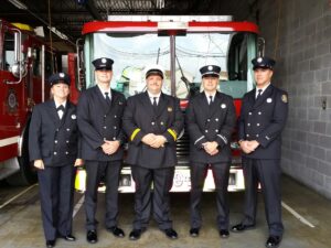 Five members of BDFD Crew standing in front of fire engine