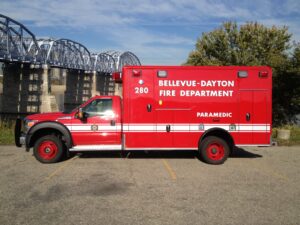 A Bellevue-Dayton Fire Department ambulance, parked at the Ohio River bank near the Purple People Bridge