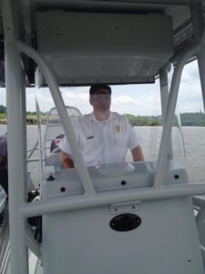 Chief Auteri of the BDFD driving a rescue boat on the Ohio River