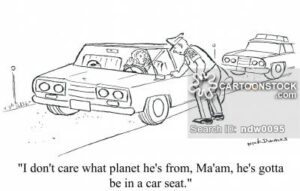 Comic strip, policeman at the window of a woman's car. Bottom text reads: I don't care wha planet he's from, Ma'am, he's gotta be in a car seat.