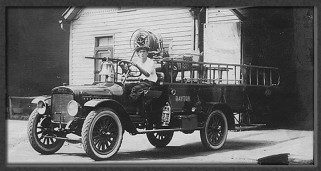 Fire truck in 1800's with driver and ladders