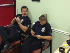FF/Medics Nick Scott and Jennifer Duke discuss nail care during a break from the squad.