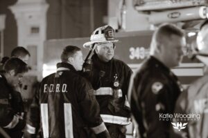 BDFD Firefighters on scene at a fire. From Far L to R: FF/Medics Nick Scott and Gary Knight discussing the fire scene with Capt. Chuck Enzweiler (middle).