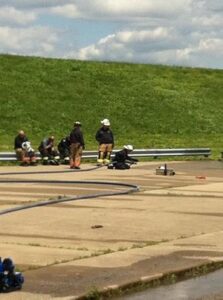 Several firefighters at floodwall/levee during training session